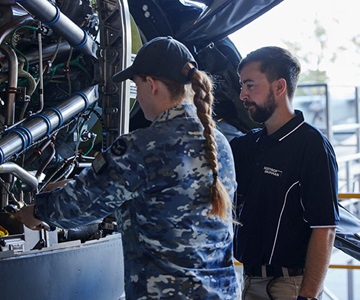 NGA technician assisting RAAF technician on a C-27J Hercules