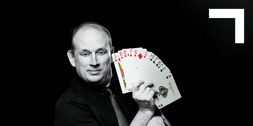 male with deck of cards