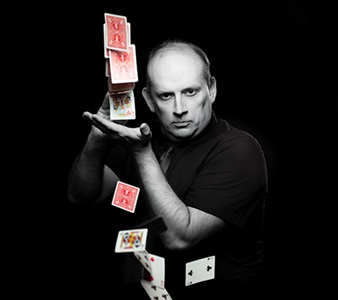 male with a deck of cards