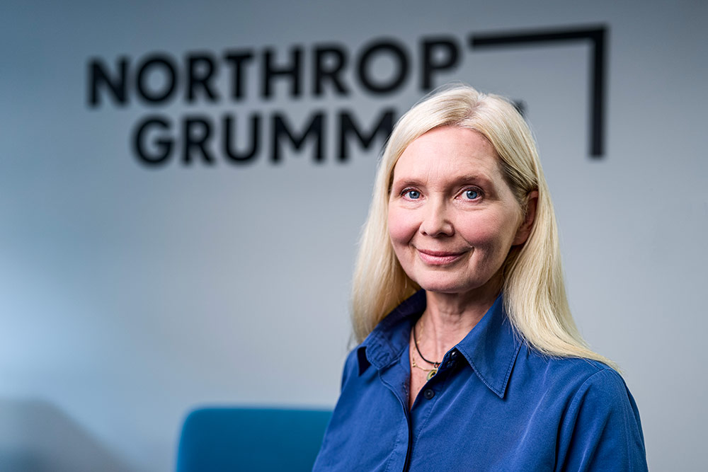 woman headshot in front of Northrop Grumman logo
