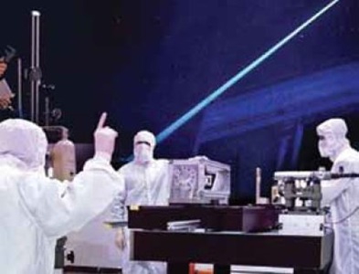 four technicians working in a lab