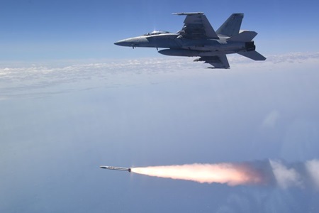 fighter jet firing a missile