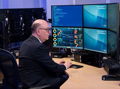Northrop Grumman Chief AI Architect Dr. Bruce Swett sits in front of a computer