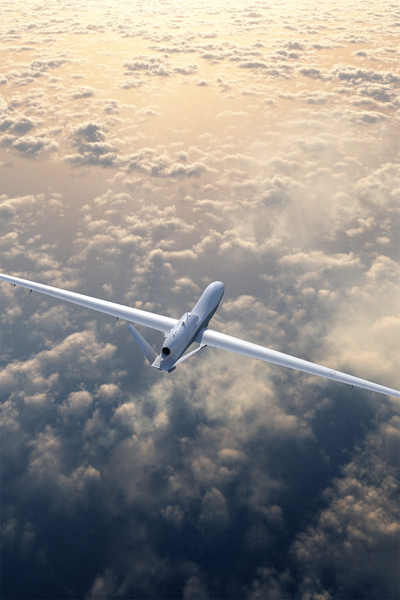 Triton unmanned aircraft flying above clouds
