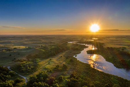 Sunrise over river in Nebraska