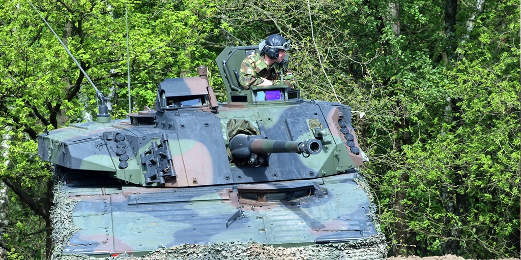man in tank with Bushmaster III Bushmaster® Chain Gun®