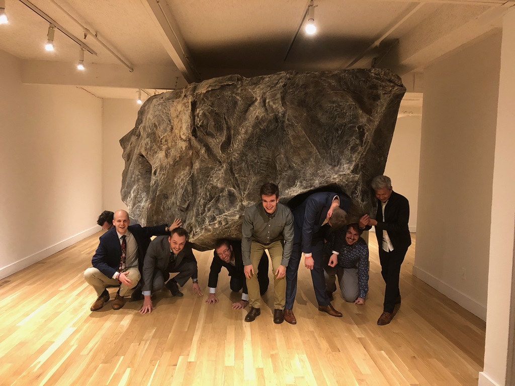 Group of Northrop Grumman Employees in front of rock in Colorado museum