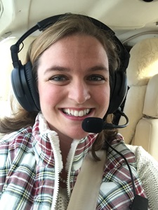 woman smiling in small plane