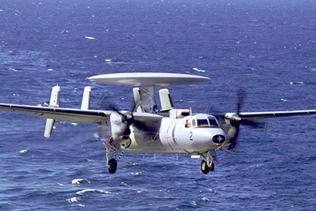 Military propeller aircraft at sea