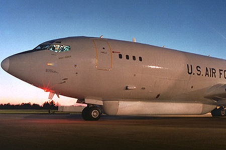 Military aircraft on tarmac at twilight