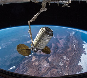 spacecraft docking at International Space Station above earth
