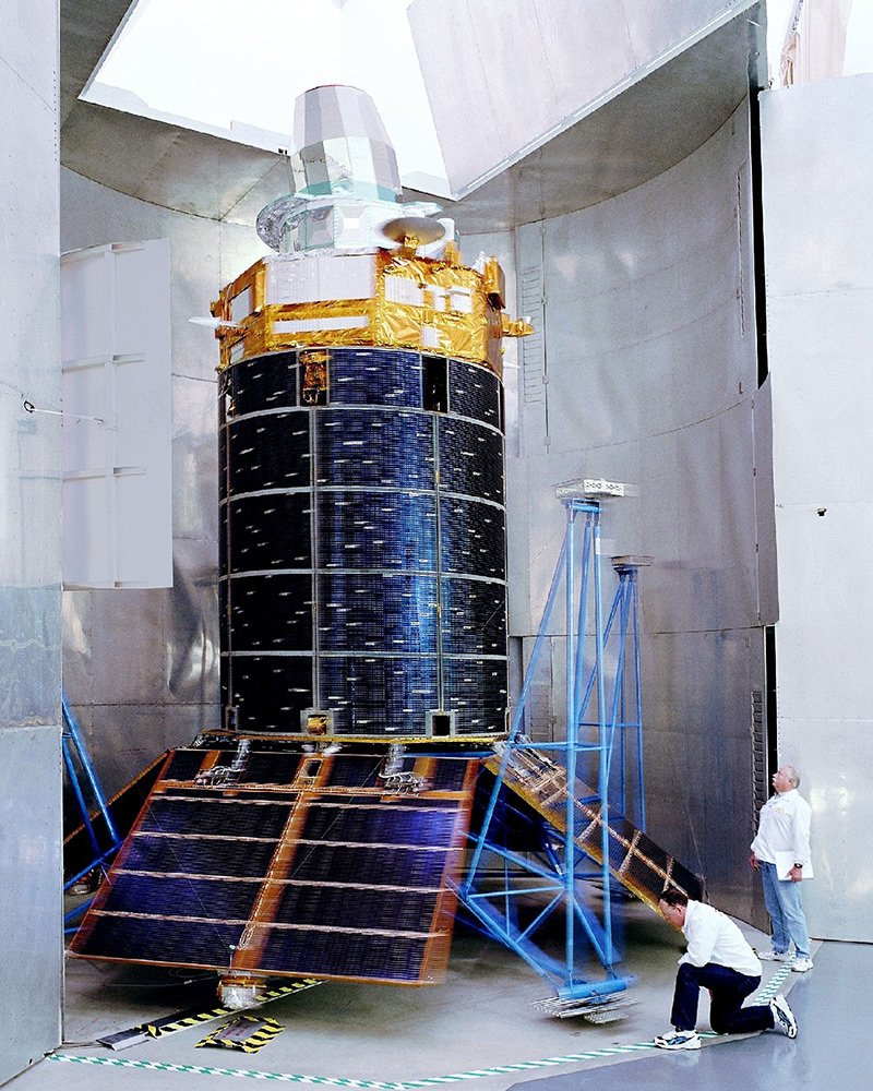 Satellite inspected by two men