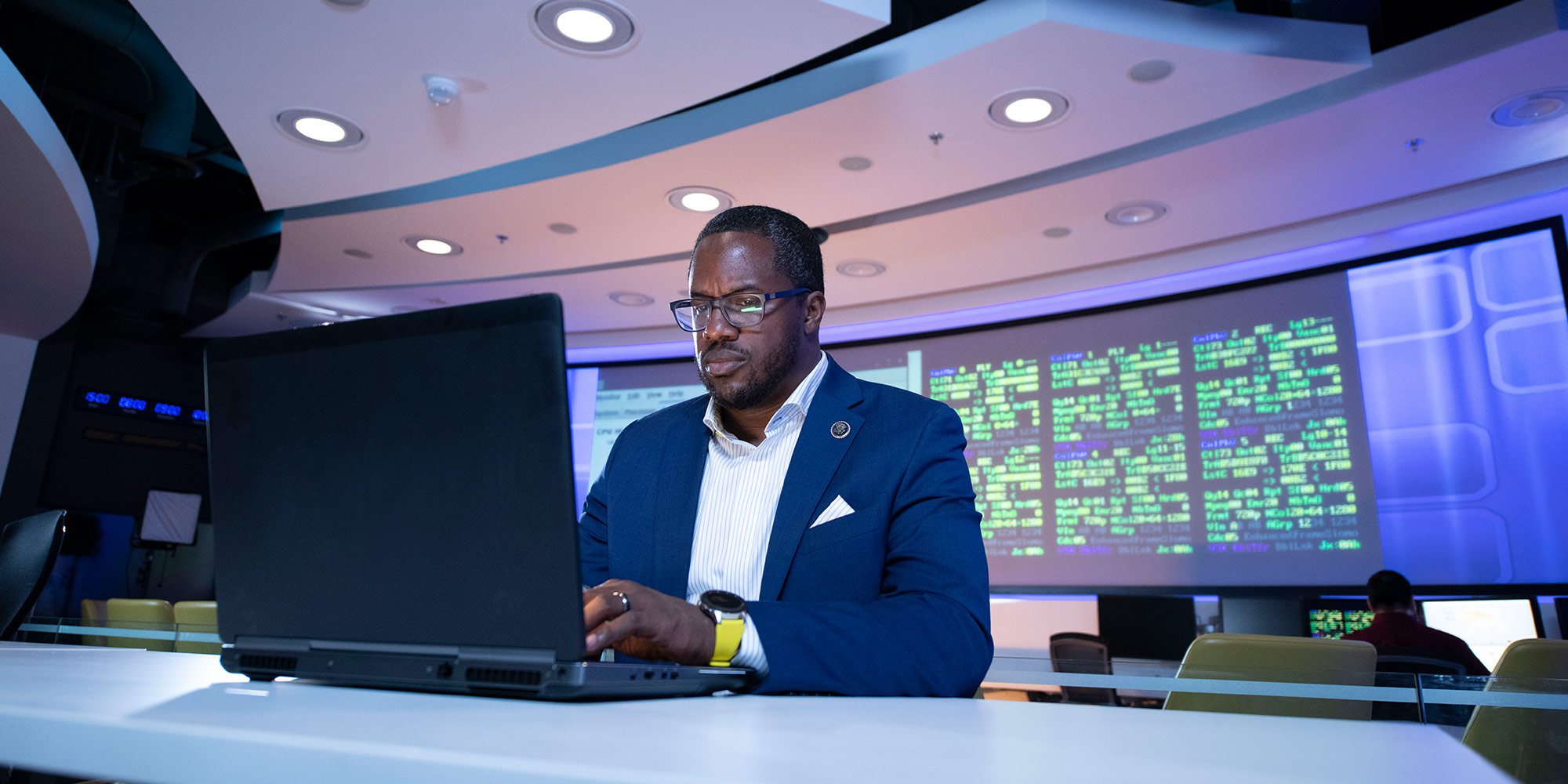 Black male on computer in cyber room