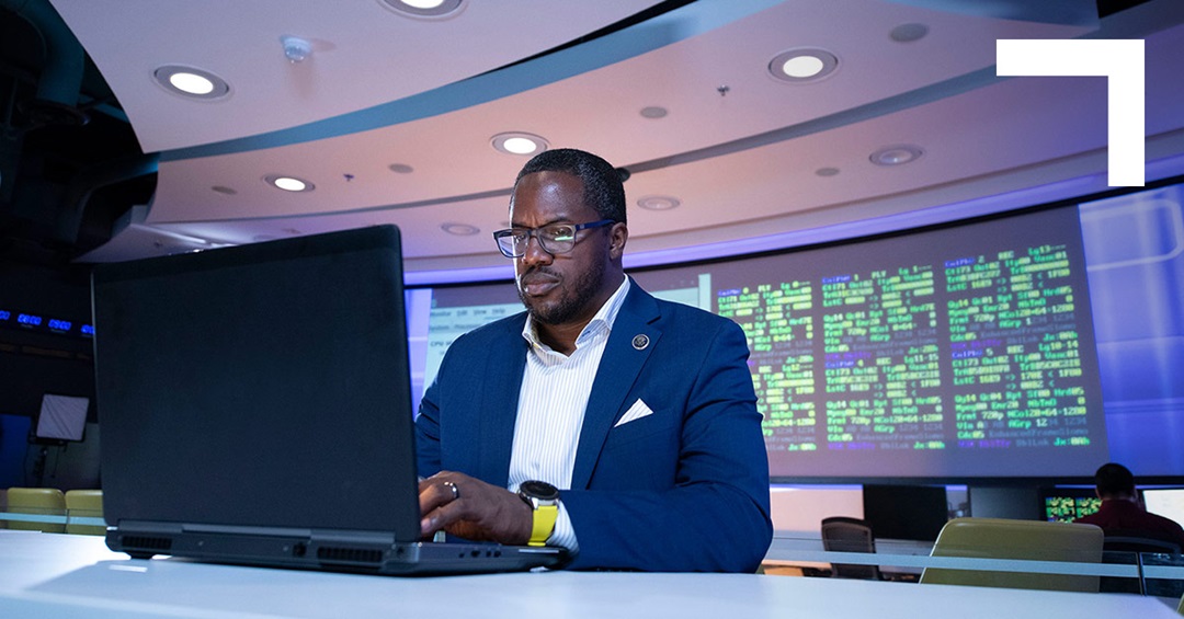black man working on a laptop