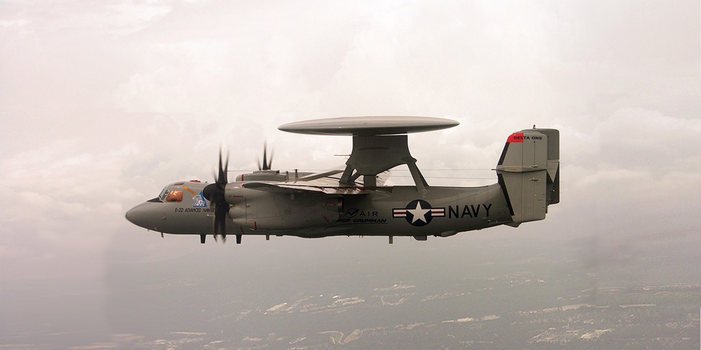 E-2D Advanced Hawkeye aircraft flying through clouds