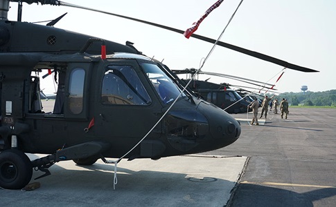 black hawk helicopter on land with blades secured