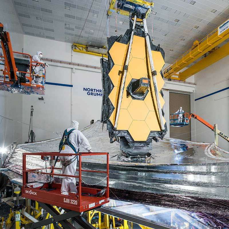 Men working on the James Webb Space Telescope in High Bay