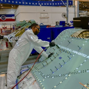 Technician working on a F35 center fuselage