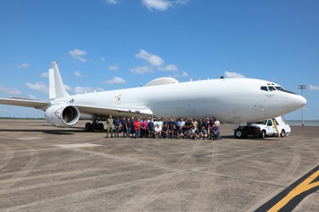 Navy aircraft on tarmac with sustainment workers