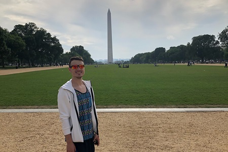 Young Adult Male Standing in front of Washington Monument