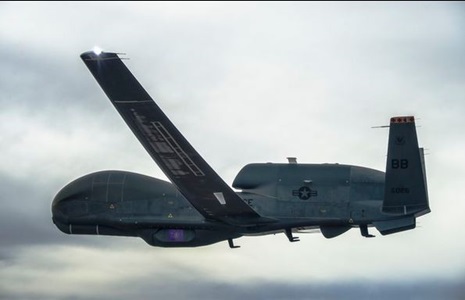 Global Hawk Autonomous aircraft flying in a cloudy sky