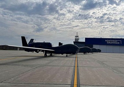 Four Global Hawk aircrafts lined up on runway