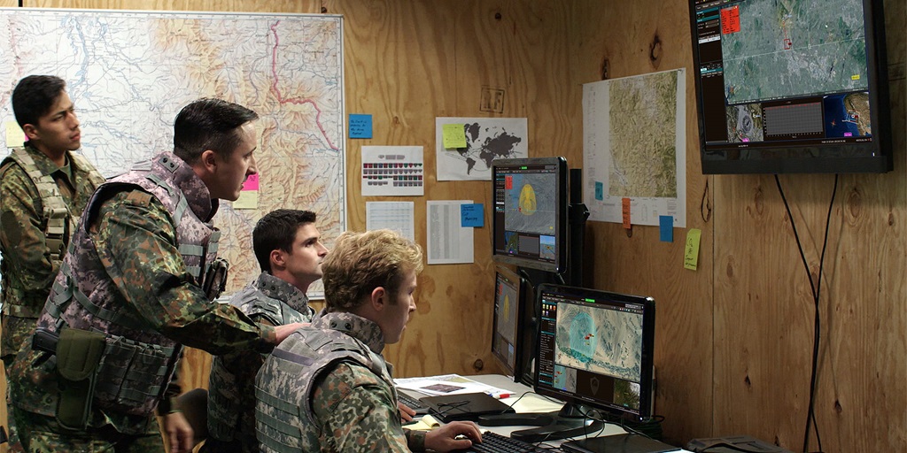 four soldiers looking at Next-generation High Power Microwave
