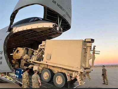 U.S. military load a C-5 aircraft with Northrop Grumman’s Integrated Battle Command System (IBCS) equipment