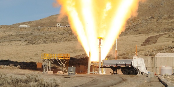 flames shooting from rocket test in desert