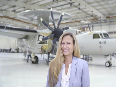 White female in hangar