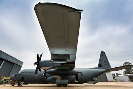 Litening sensor pod hangs from the wing of a C-130J Hercules aircraft