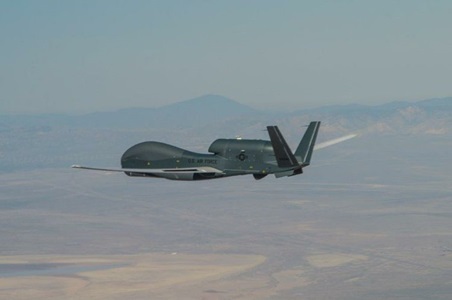 Global Hawk unmanned plane flying over desert