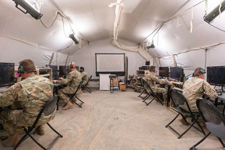 US military troops in tent on computer network