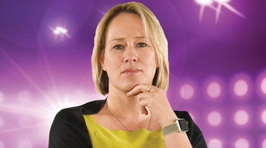 Woman Standing in Front of Purple Background