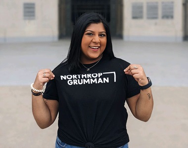Young woman intern wearing Northrop Grumman t-shirt