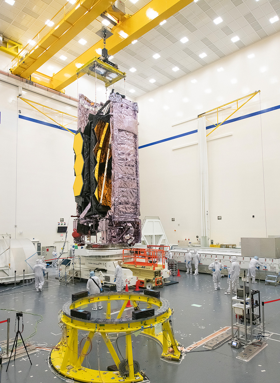 telescope in cleanroom with technicians working