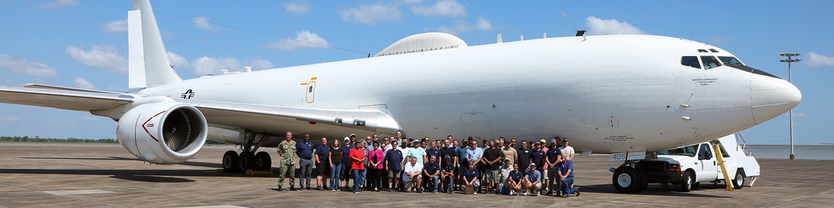 large group of people standing in front of USAF aircraft