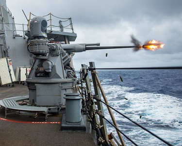 navy ship firing gun