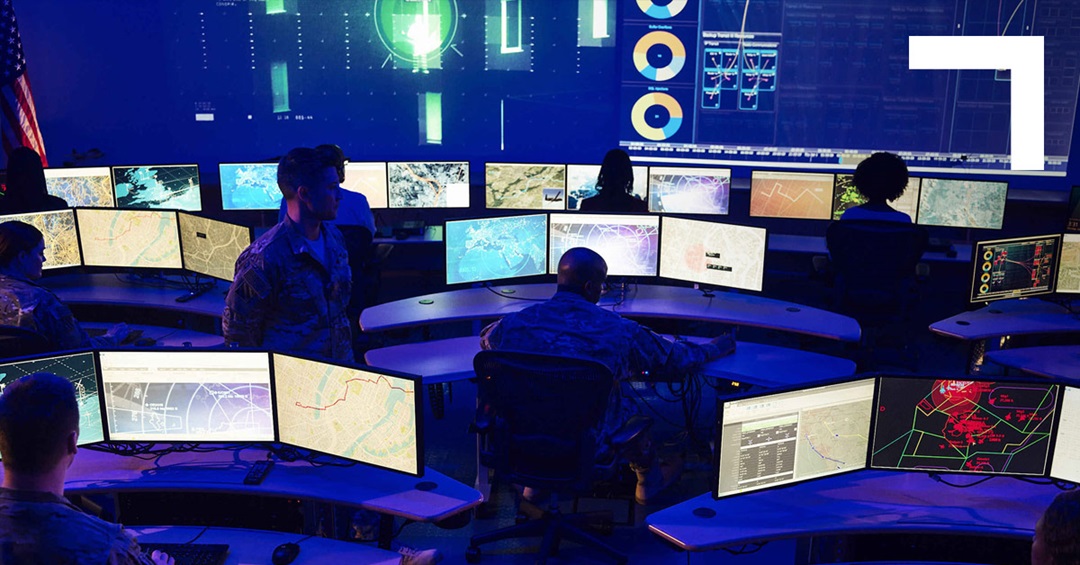 cyber command center with employees and monitors