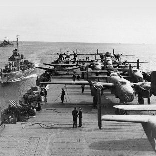 fleet of planes on a carrier