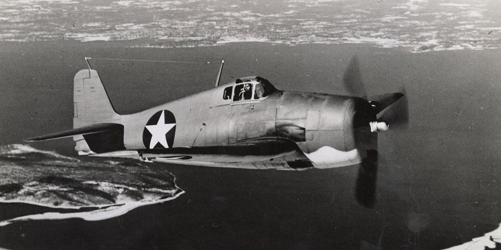 World War II military airplane flying above New York