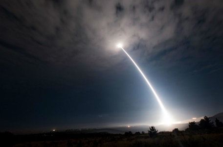 Missile shooting into the sky at night
