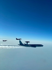 F-16 viper aircraft and E-3 sentry aircraft in flight