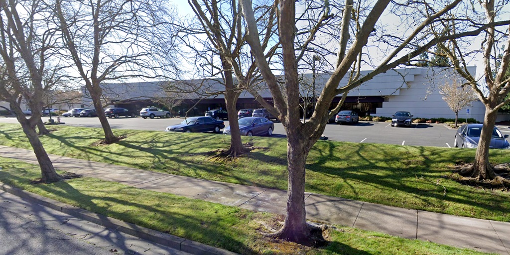 business office, parking lot and trees