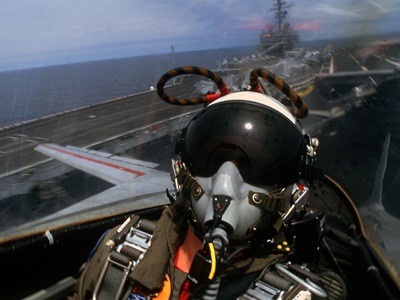 fighter pilot flying a jet