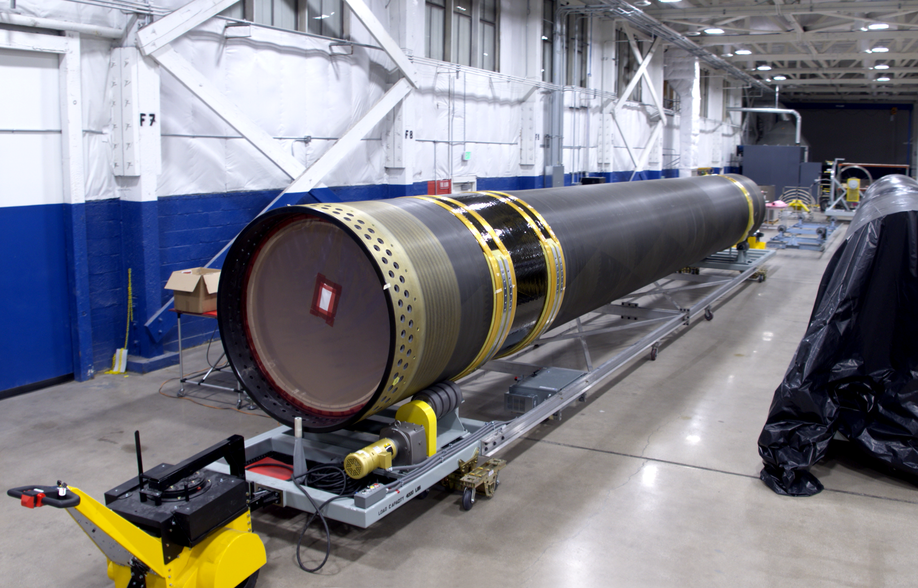 A GEM 63XL rocket motor completes case winding and waits to be filled with propellant.