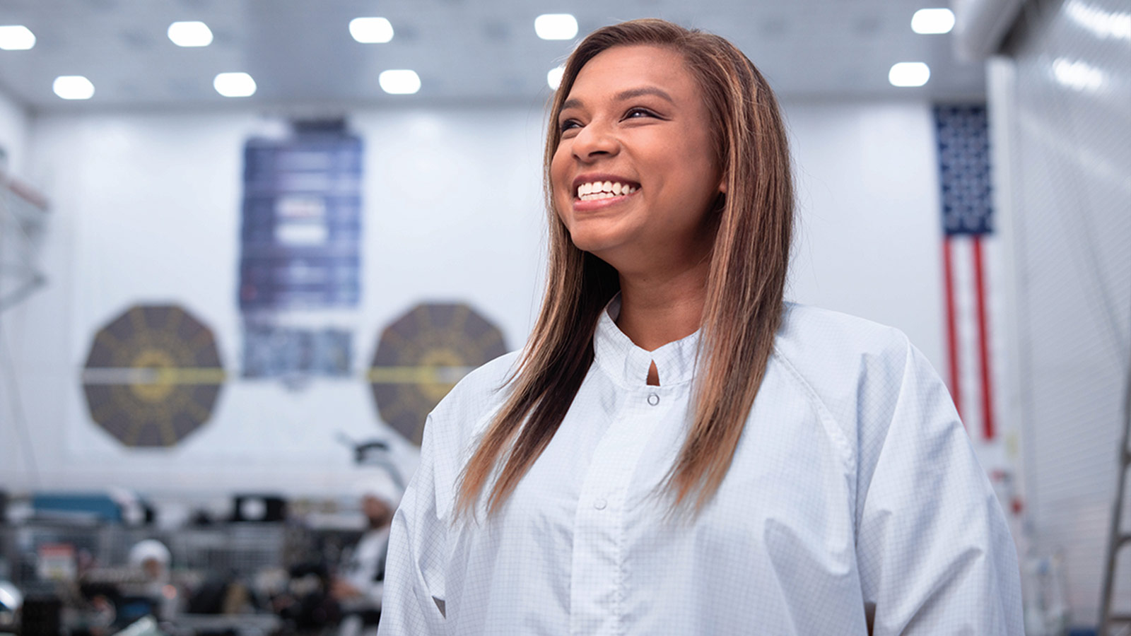 smiling Black woman in white clean room