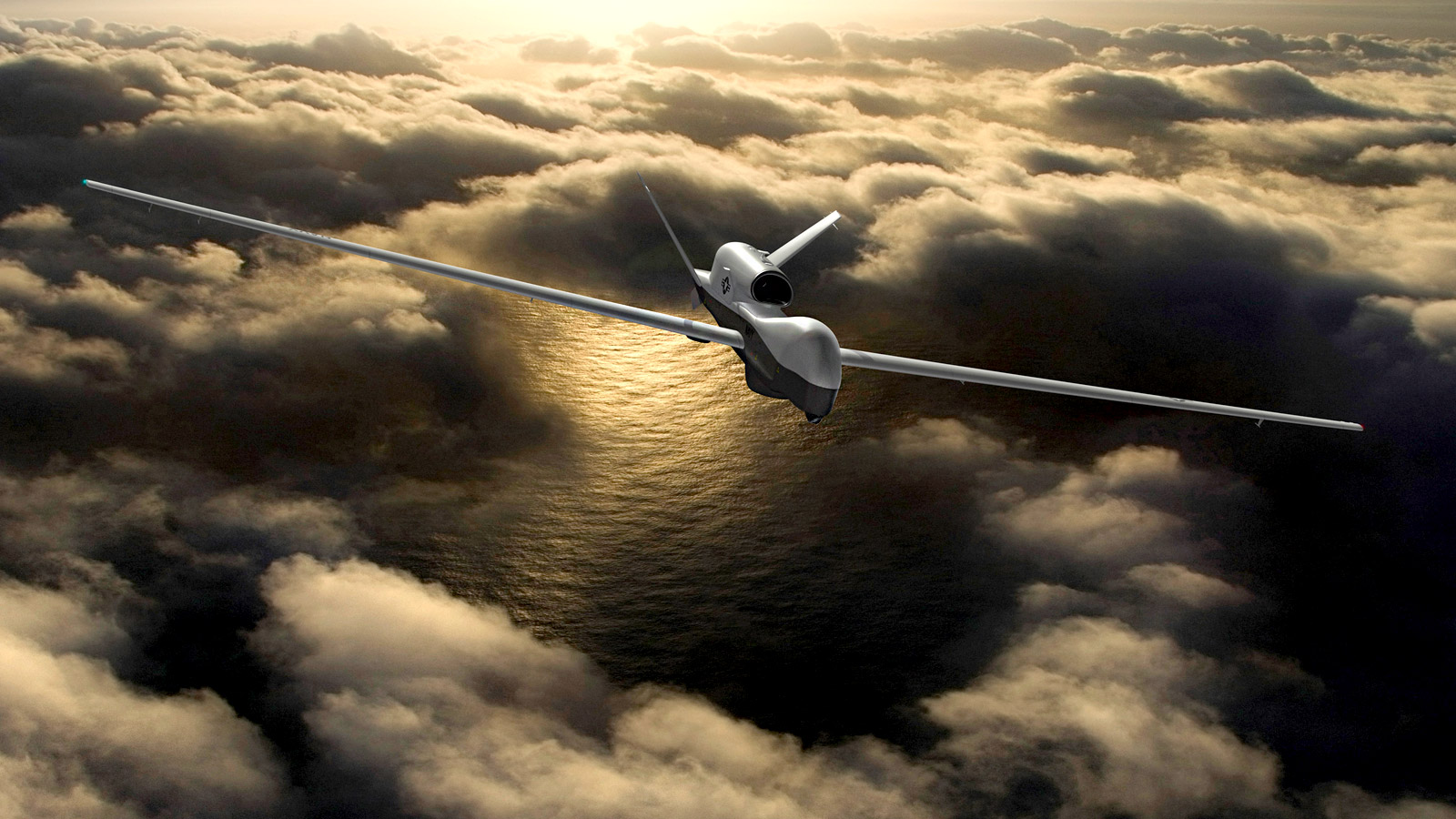 unmanned plane flying in clouds above ocean